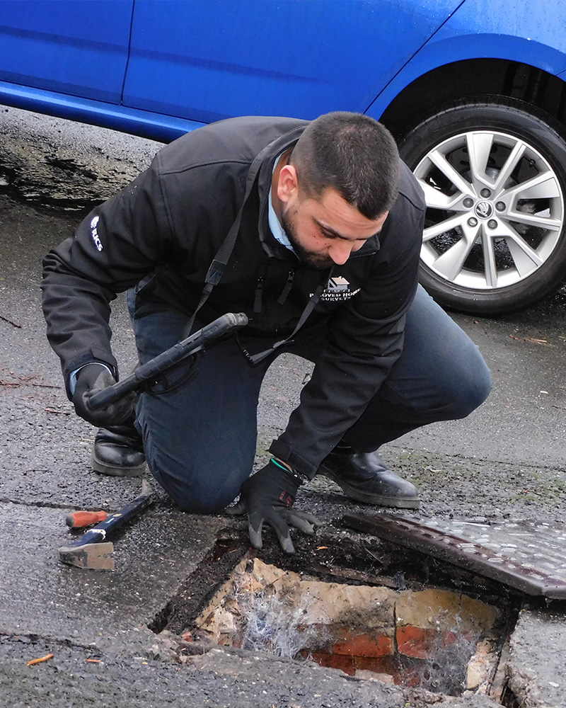 costas inspecting a drain in ecclesall